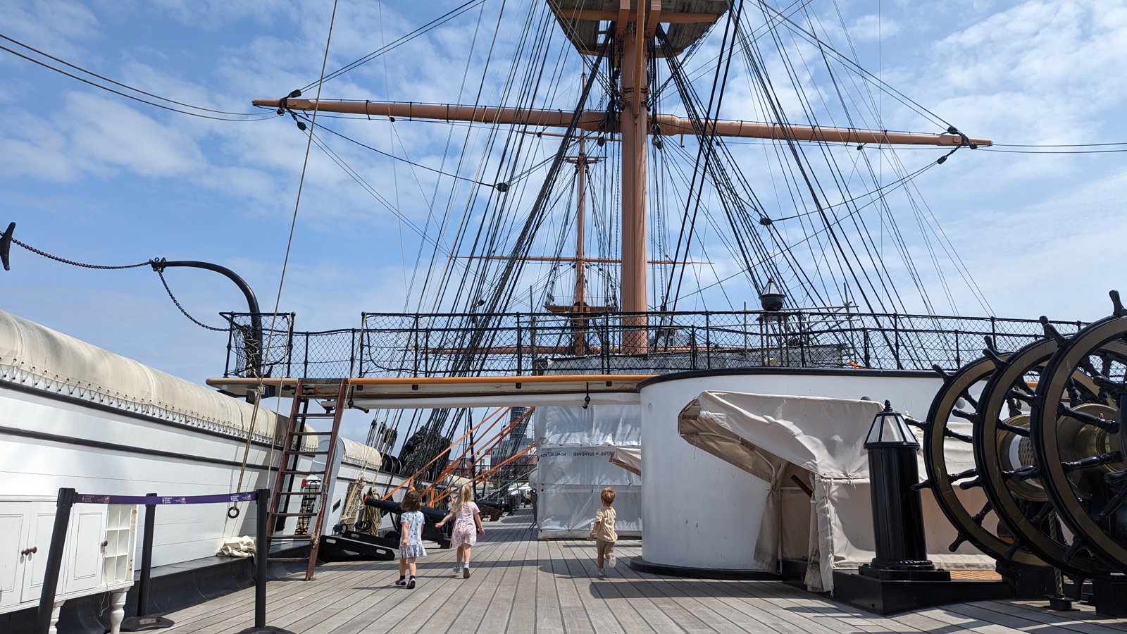 Children running on the deck of the historic ship at Portsmouth Historic Dockyard